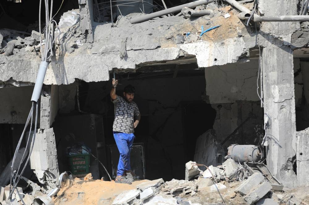 A Palestinian man gestures a day after Israeli strikes on houses in Jabalia refugee camp in the northern Gaza Strip, Wednesday. REUTERS