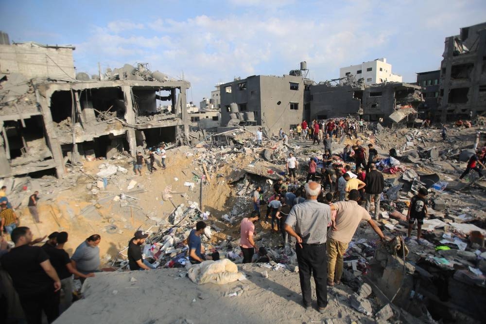 Palestinians check the destruction in the aftermath of an Israeli strike in the Jabalia camp for Palestinian refugees in the Gaza Strip, on Wednesday. AFP