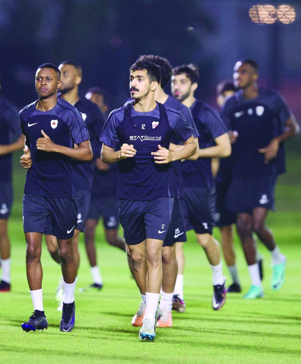 Al Rayyan players warm up during a training session on Wednesday.