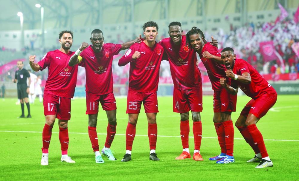 Al Duhail’s Michael Olunga (third right) celebrates with teammates after their win over Al Rayyan in the Expo Stars League at the Abdullah Bin Khalifa Stadium on Thursday.