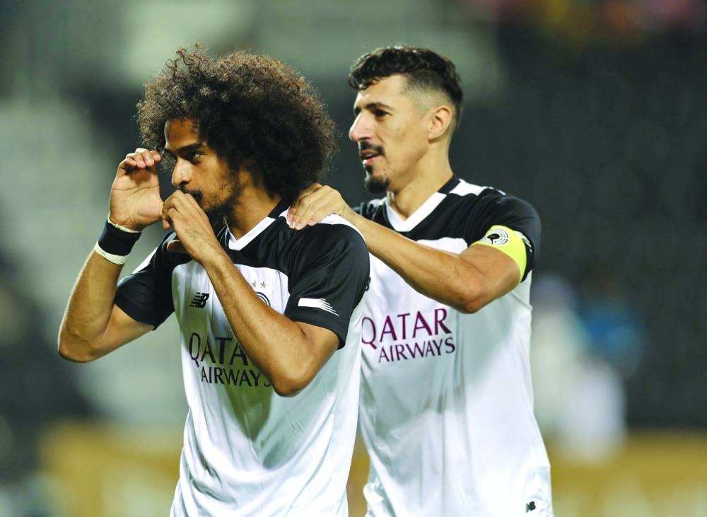 Akram Afif scored four goals while Baghdad Bounedjah (right) struck once in Al Sadd’s rout of Markhiya at the Jassim Bin Hamad Stadium on Thursday.