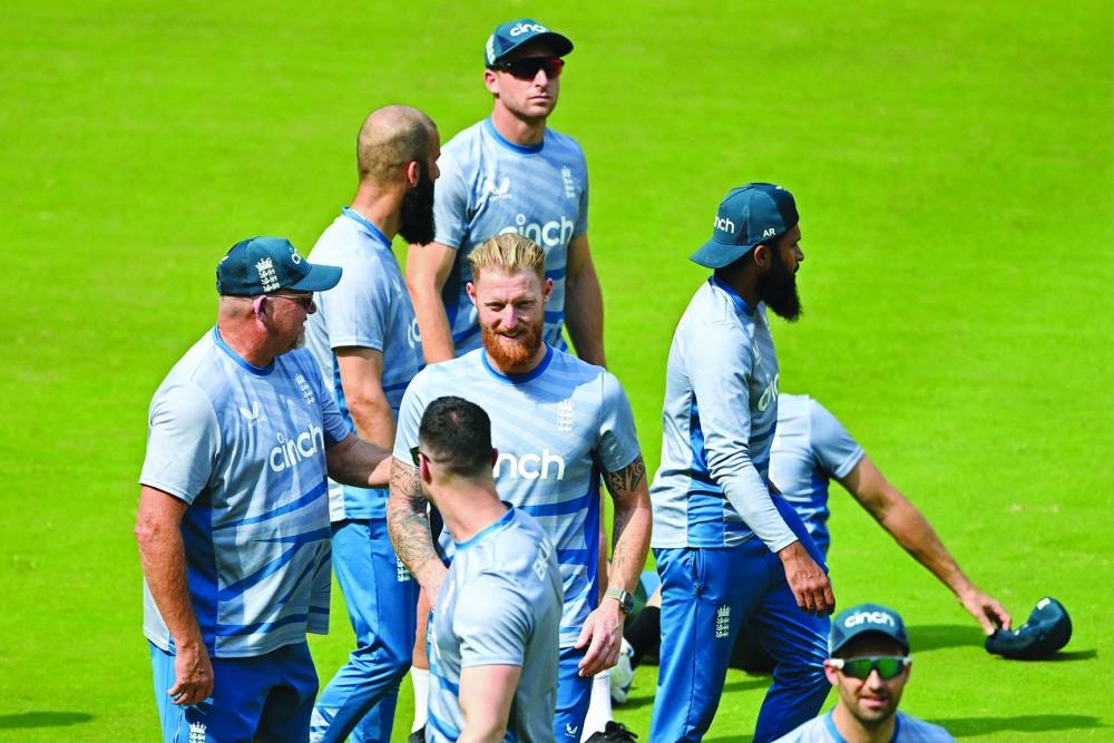 England's Ben Stokes (centre) along with teammates attends a practice session on the eve of their 2023 ICC World Cup match against Australia in Ahmedabad. (AFP) 