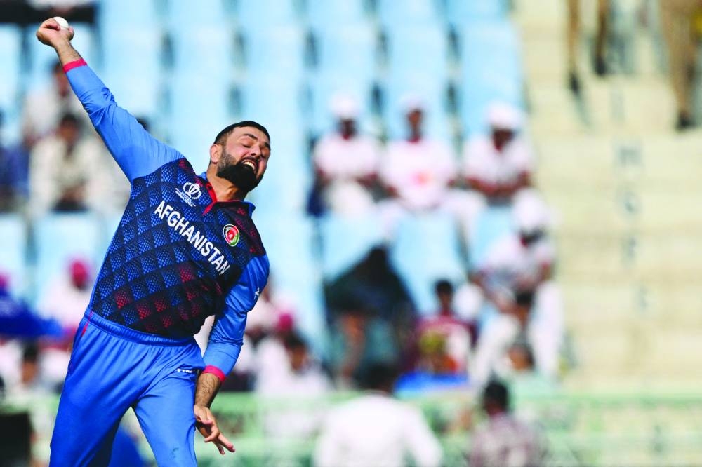 Afghanistan’s Mohamed Nabi bowls during the 2023 ICC World Cup match against Netherlands in Lucknow on Friday. (AFP)