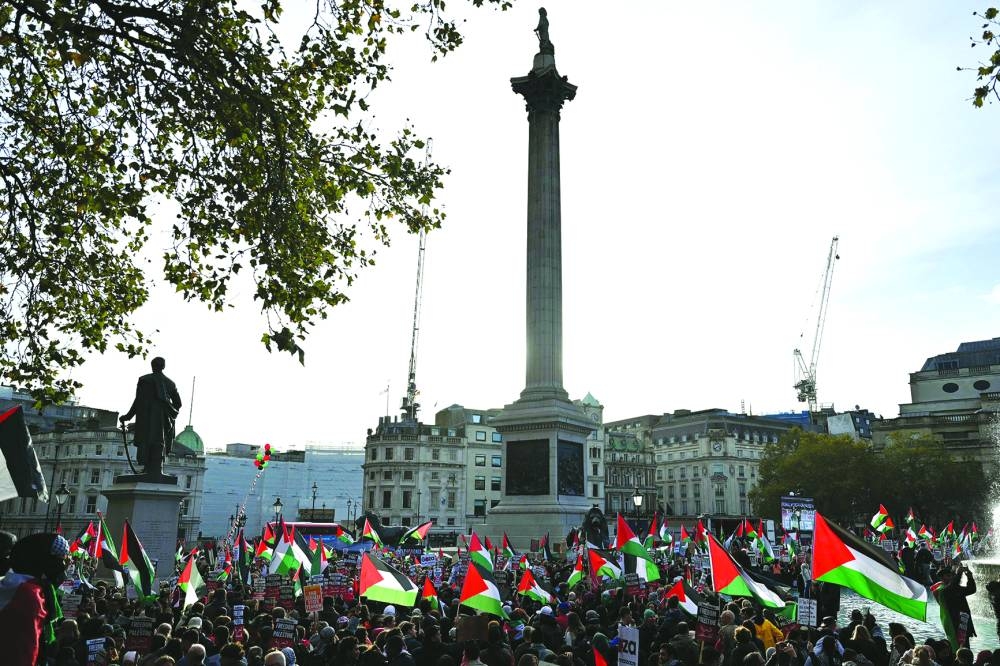 
Protesters gather with placards and flags during the ‘London Rally For Palestine’ in Trafalgar Square, central London. 