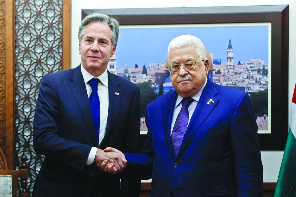 
US Secretary of State Antony Blinken shakes hands with Palestinian president Mahmoud Abbas at the Palestinian Muqataa Presidential Compound in the West Bank city of Ramallah, yesterday. 