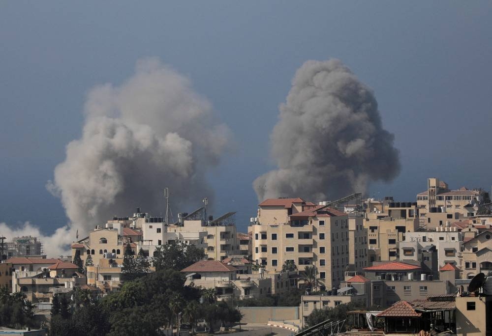Smoke rises after Israeli strikes in Gaza City Monday. REUTERS