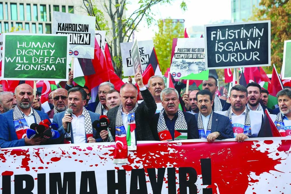 
Demonstrators shout slogans during a protest against US Secretary of State Antony Blinken’s visit to Turkiye, near the US embassy in Ankara, Turkiye, yesterday. 