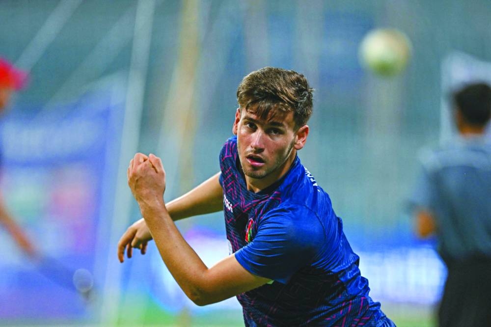 
Afghanistan’s Noor Ahmad delivers a ball during a practice session ahead of their ICC World Cup match against Australia at the Wankhede Stadium in Mumbai. (AFP) 