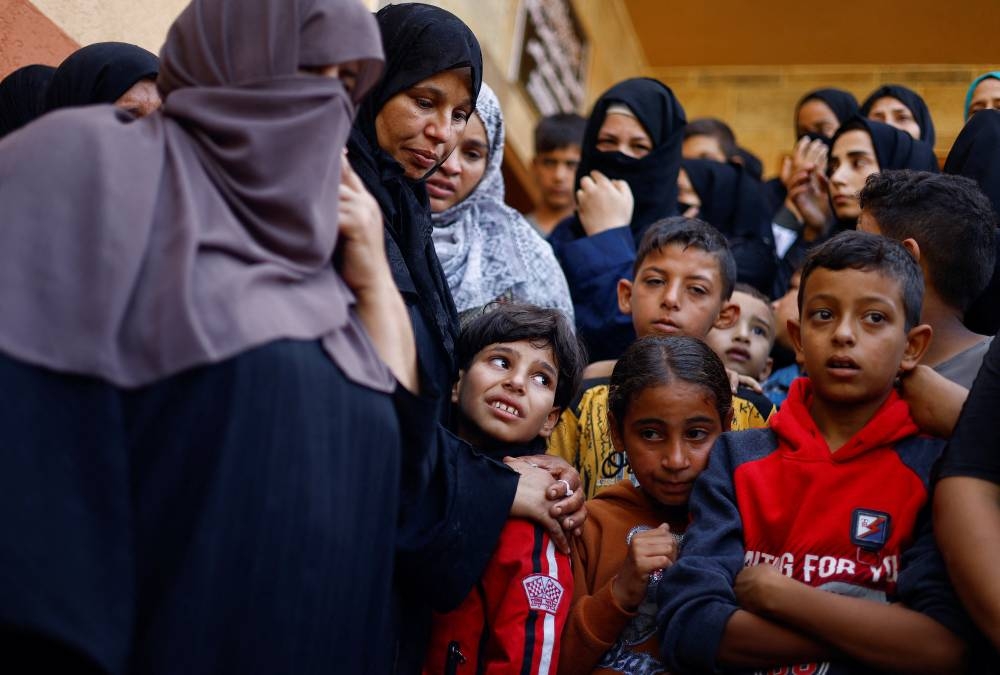 People mourn Palestinians killed in Israeli strikes at a hospital in Khan Younis in the southern Gaza Strip, Wednesday. REUTERS
