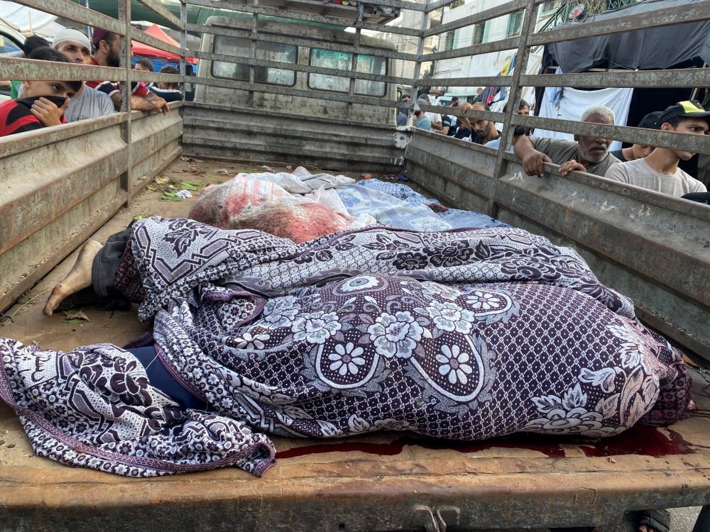 Bodies of Palestinians killed in Israeli strikes lie on a truck at Al Shifa hospital, in Gaza City, Wednesday. REUTERS