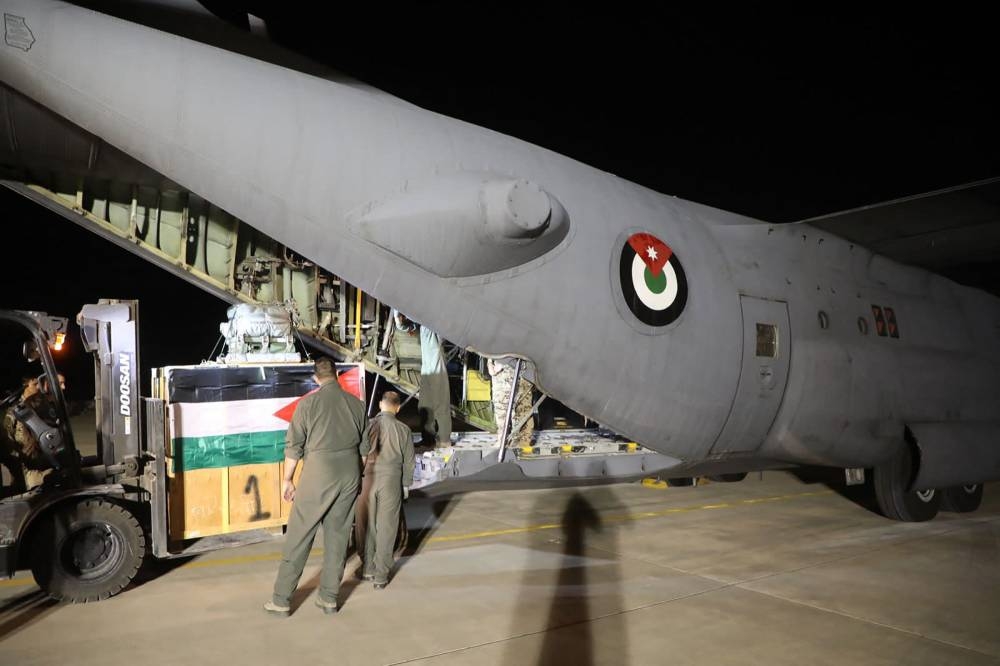 Humanitarian aid being loaded into a Jordanian military cargo plane. Jordanian Armed Forces / AFP