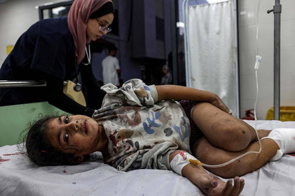An injured Palestinian girl receives treatment at the Kuwaiti Hospital in Rafah in the southern Gaza Strip, on Friday. REUTERS
