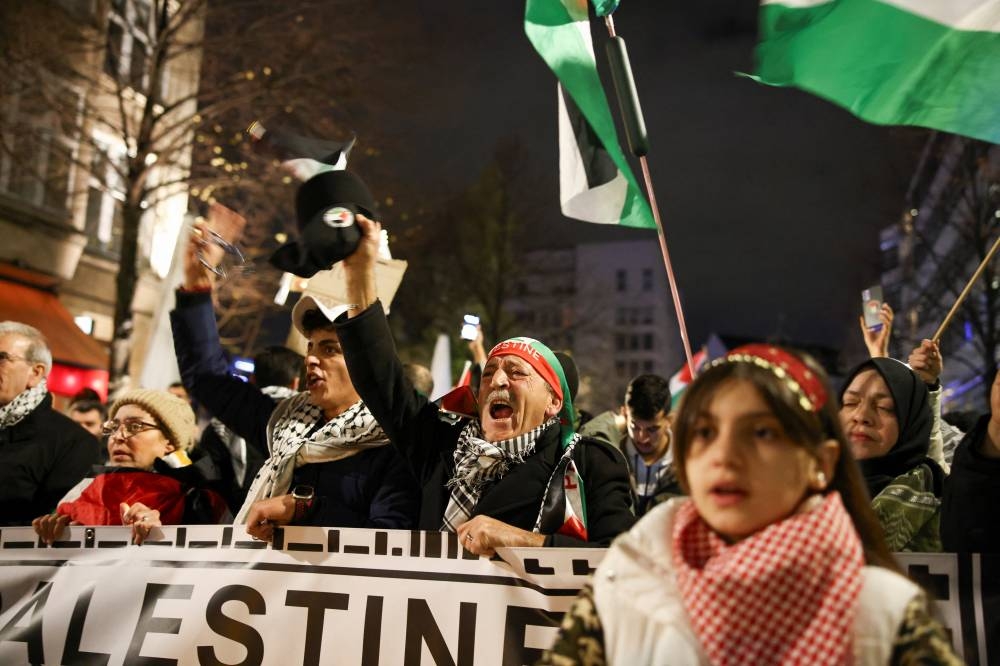 People take part in a demonstration in support of Palestinians in Gaza, in Berlin, Germany, Friday. REUTERS