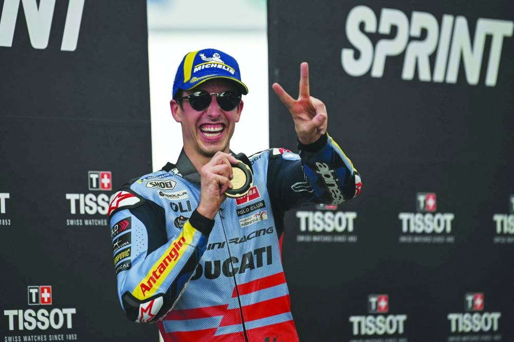 TOPSHOT - Gresini Racing MotoGP's Spanish rider Alex Marquez celebrates winning the Tissot Sprint race during the MotoGP Malaysian Grand Prix at the Sepang International Circuit in Sepang on November 11, 2023. (Photo by MOHD RASFAN / AFP)