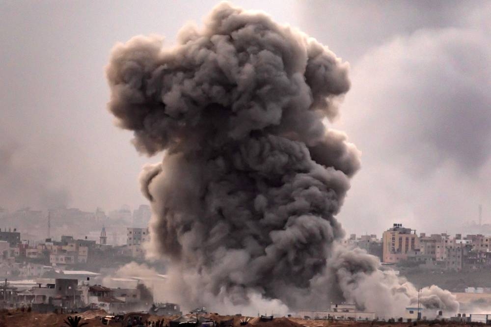 This picture taken on Sunday from a position along the border with the Gaza Strip in southern Israel shows a smoke plume erupting during Israeli bombardment on the Palestinian enclave amid ongoing battles. AFP