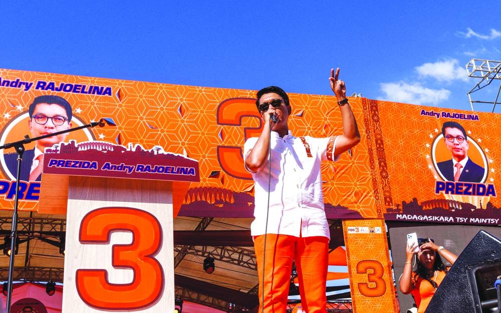 
Madagascar’s outgoing president and candidate for re-election Andry Rajoelina addresses supporters during his final presidential campaign rally ahead of the upcoming election at the Coliseum of Antsonjombe in Antananarivo, yesterday. 