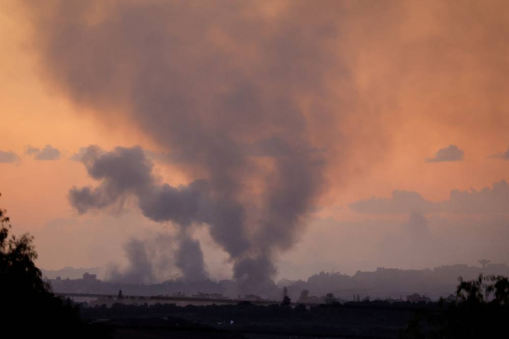 Smoke rises above Gaza, as seen from southern Israel, Wednesday. REUTERS