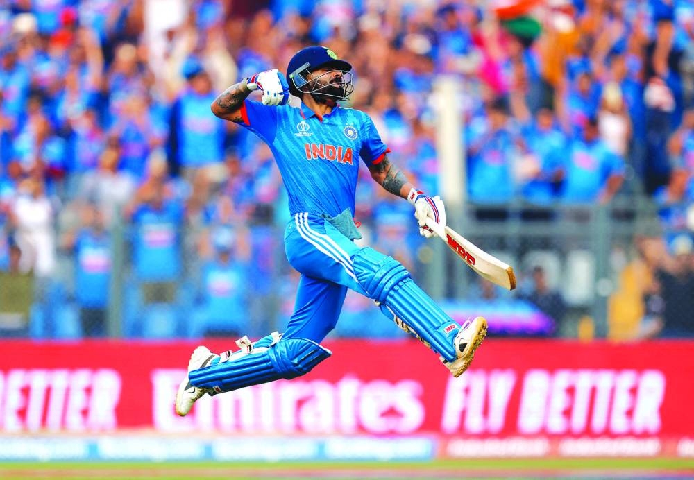 India’s Virat Kohli celebrates after reaching his 50th century, breaking Sachin Tendulkar’s record of most number of ODI centuries, in 
Mumbai yesterday. (Reuters)