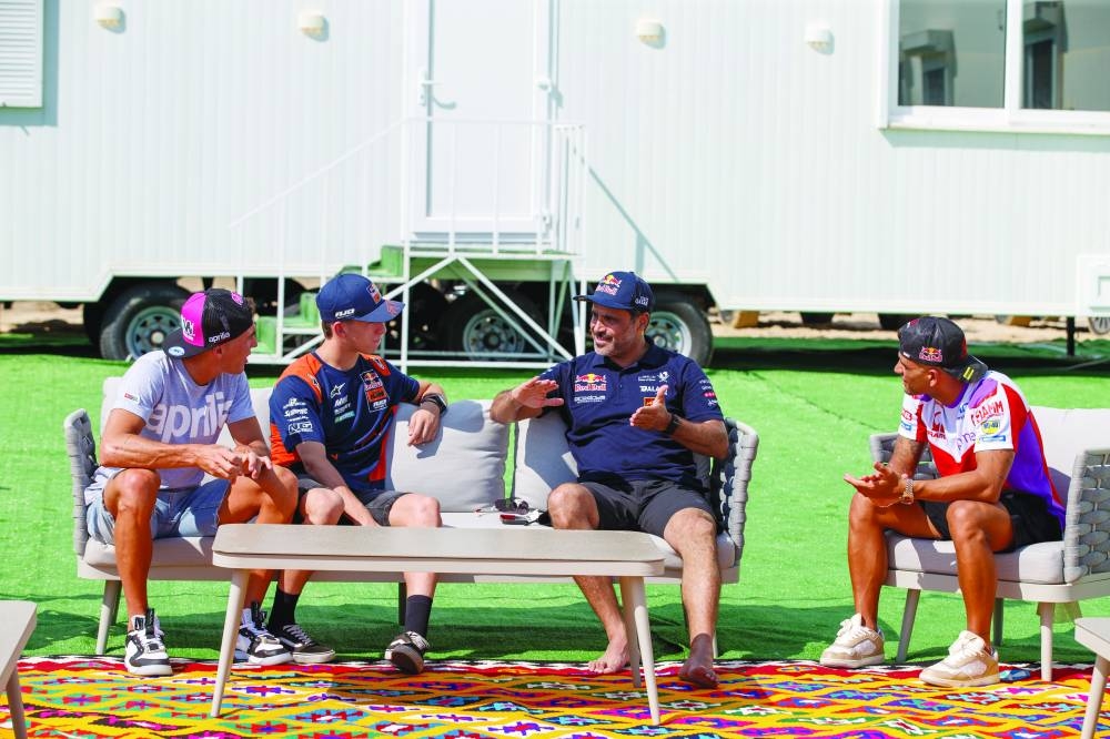 
MotoGP riders Pedro Acosta, Alexis Espargaro and Jorge Martin are engaged in a deep conversation with Qatari rally legend Nasser al-Attiyah at the Nasser Rally Camp yesterday, ahead of this weekend’s MotoGP Qatar Airways Grand Prix of Qatar. 