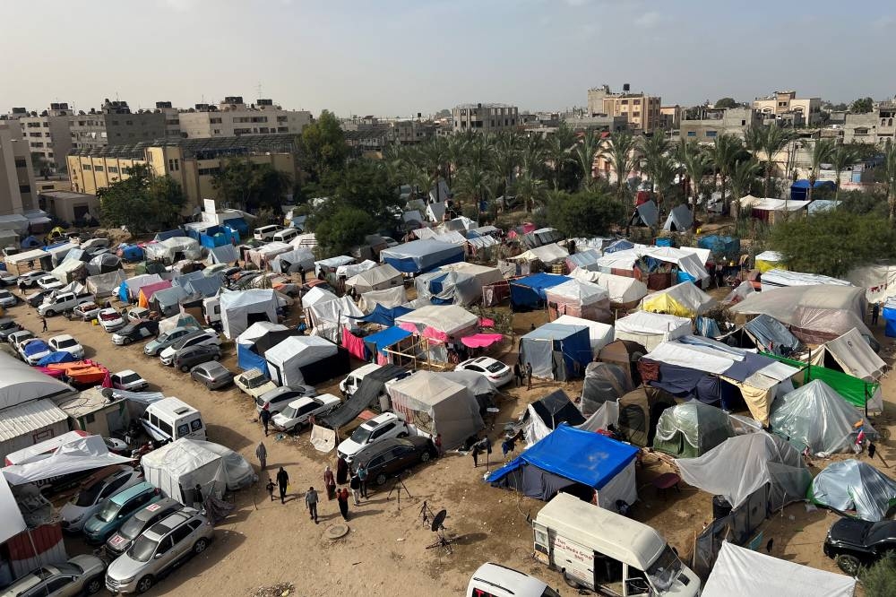 Displaced Palestinians, who fled their houses due to Israeli strikes, shelter in tents at Nasser hospita in Khan Younis in the southern Gaza Strip, on Sunday. REUTERS