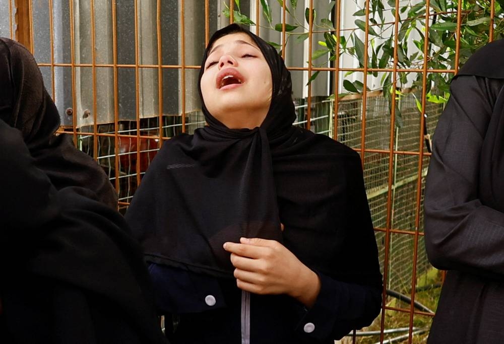 A relative of Palestinians killed in Israeli strikes mourns at Nasser hospital in Khan Younis in the southern Gaza Strip, on Sunday. REUTERS