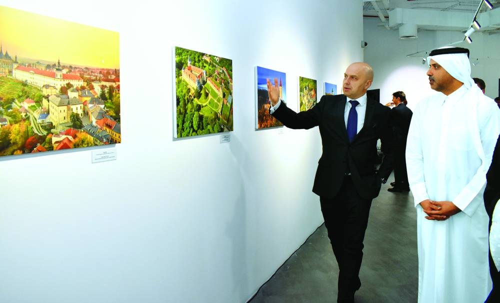 Czech ambassador Chalupsky briefs al-Dosari about Czech artist Lebor Svatik's photographs at the opening of the 'Beauties of Czechia' exhibition on Sunday. PICTURES: Thajudheen