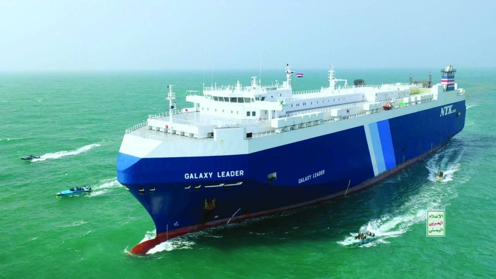 The Galaxy Leader cargo ship is escorted by Houthi boats in the Red Sea in this photo released Monday.