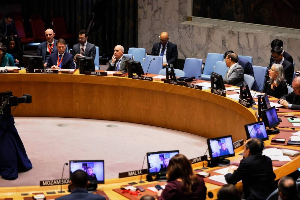Members of the UN Security Council watch as Executive Director of UNICEF Catherine Russell speaks on a screen during a meeting on the situation in the Middle East, and the Israel-Hamas war at the United Nations headquarters on Wednesday in New York City. Getty Images/AFP