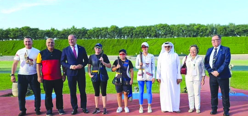 
The women’s skeet podium winners pose with the officials. 