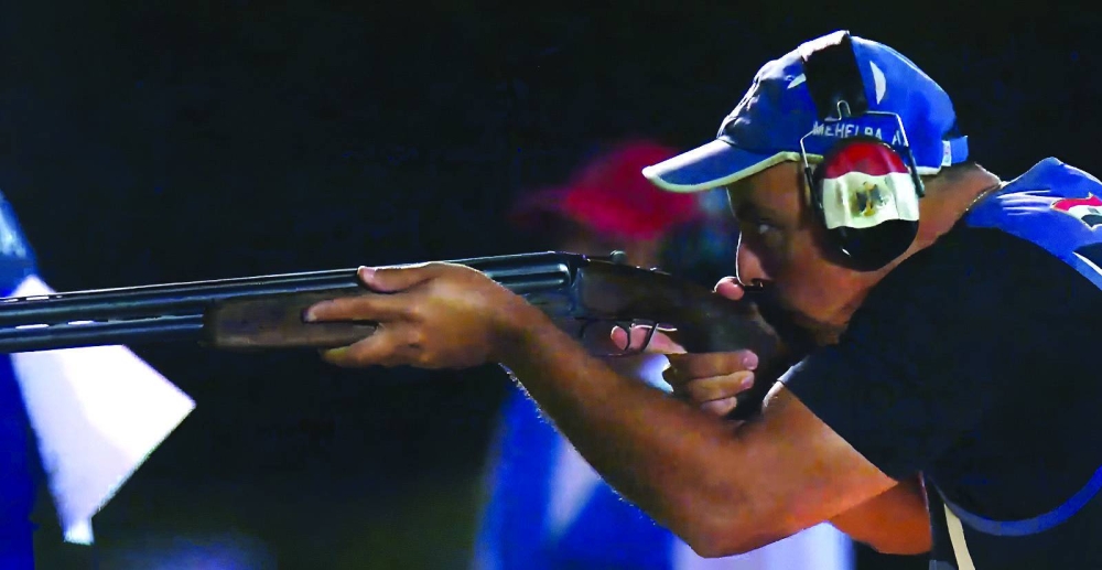 
Egypt’s Abdel Aziz Mehelba aims for a target during the men’s trap final at the ISSF World Cup Finals at Lusail Shooting Range yesterday. 