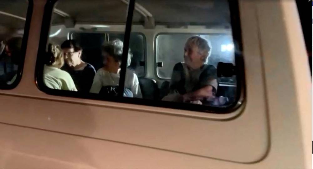 A vehicle carrying hostages arrives at the Rafah border, amid a hostages-prisoners swap deal between Hamas and Israel, from southern Gaza Strip Friday. REUTERS