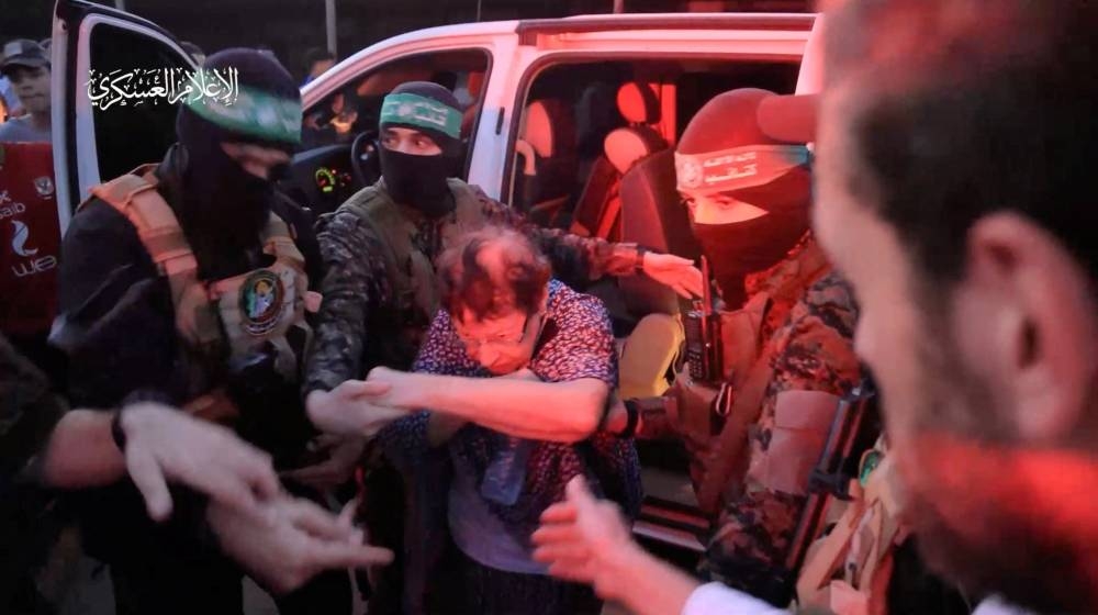 Israeli hostages are being handed over by Hamas to the International Red Cross, as part of a hostages-prisoners swap deal between Hamas and Israel amid a temporary truce, in an unknown location in the Gaza Strip, on Friday. Pictures: Hamas Military Wing/Handout via REUTERS