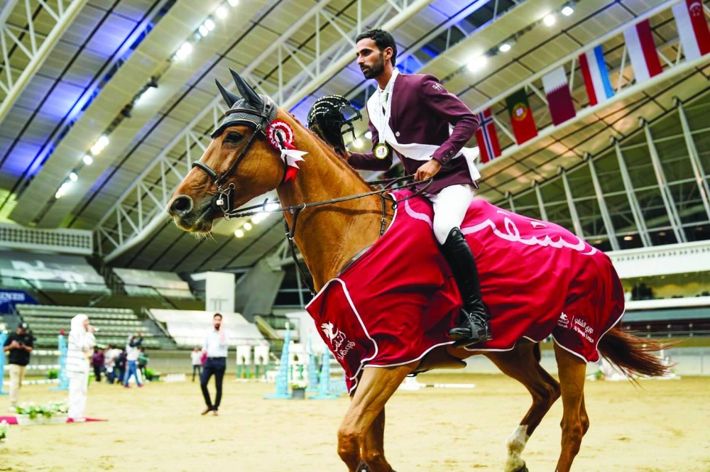 
Rashid Towaim al-Marri astride Van Gallettana Z celebrates after winning the Open Class during the first edition of the Al Shaqab International League yesterday. 