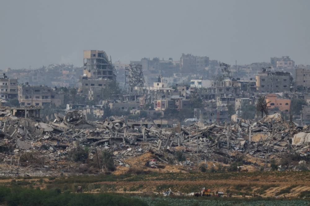 Destroyed buildings lay in ruin in Gaza, as seen from southern Israel, during the temporary truce between Hamas and Israel, on Saturday. REUTERS