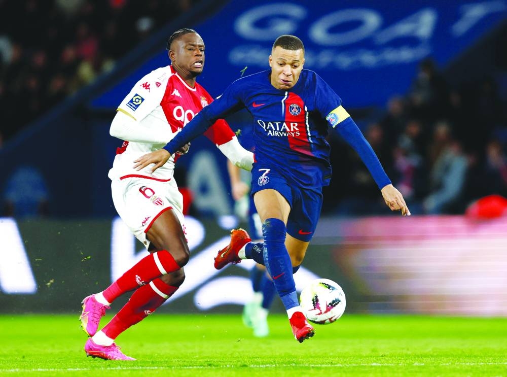 
Paris St Germain’s Kylian Mbappe (right) in action with AS Monaco’s Denis Zakaria during the Ligue 1 on Friday night. (Reuters) 