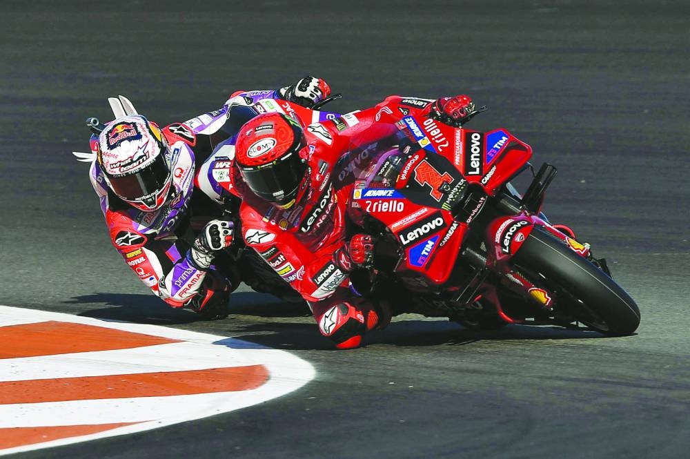 
Ducati Lenovo Team’s Francesco Bagnaia and Prima Pramac Racing’s Jorge Martin in action during the sprint race at Valencia Grand Prix held at Circuit Recardo Tormo in Spain yesterday. Below: Jorge Martin celebrates his win. (Reuters) 
