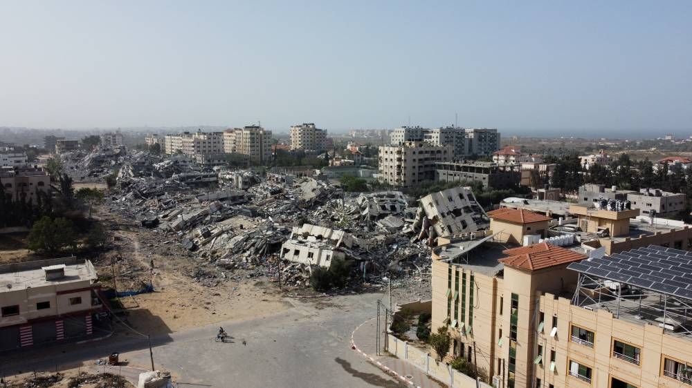 Residential buildings, destroyed in Israeli strikes during the conflict, lie in ruin, amid a temporary truce between Israel and Hamas, in southern Gaza City on Sunday. REUTERS