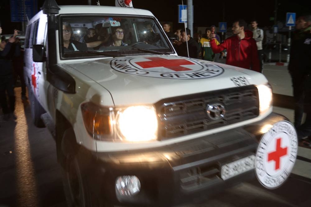 A Red Cross vehicle, as part of a convoy carrying hostages arrives at the Rafah border, in the southern Gaza Strip Sunday. REUTERS