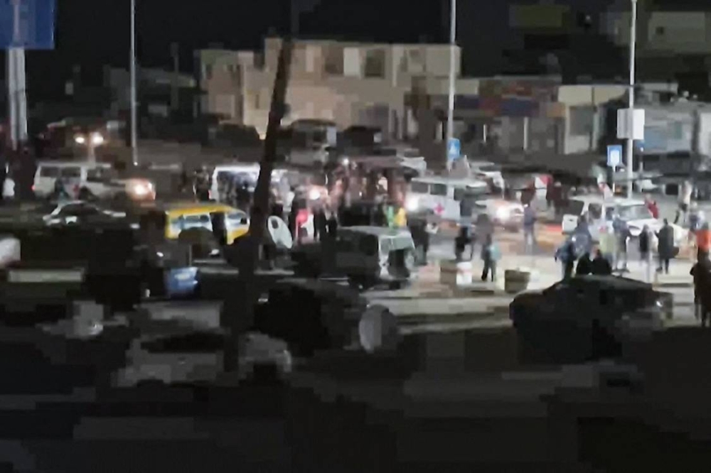 An International Red Cross vehicles reportedly carrying hostages released by Hamas in the Gaza Strip driving towards the Rafah border point with Egypt ahead of their transfer to Israel. AFP