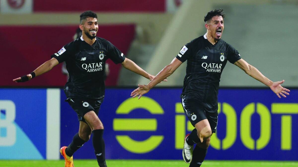 
Al Sadd’s Baghdad Bounedjah (right) celebrates with teammate Mohamed Waad after scoring against Sharjah FC during the AFC Champions League group stage match in Sharjah, UAE, yesterday. 