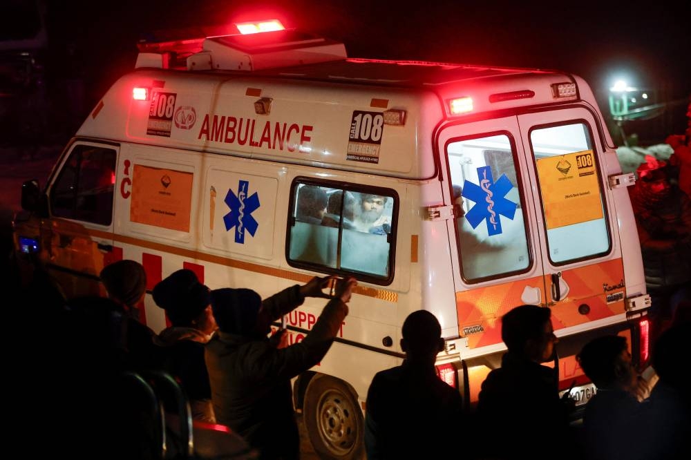 An ambulance carries survivors as rescue operations are underway to rescue trapped workers after a tunnel collapsed, in Uttarkashi in the northern state of Uttarakhand, India, Tuesday. REUTERS
