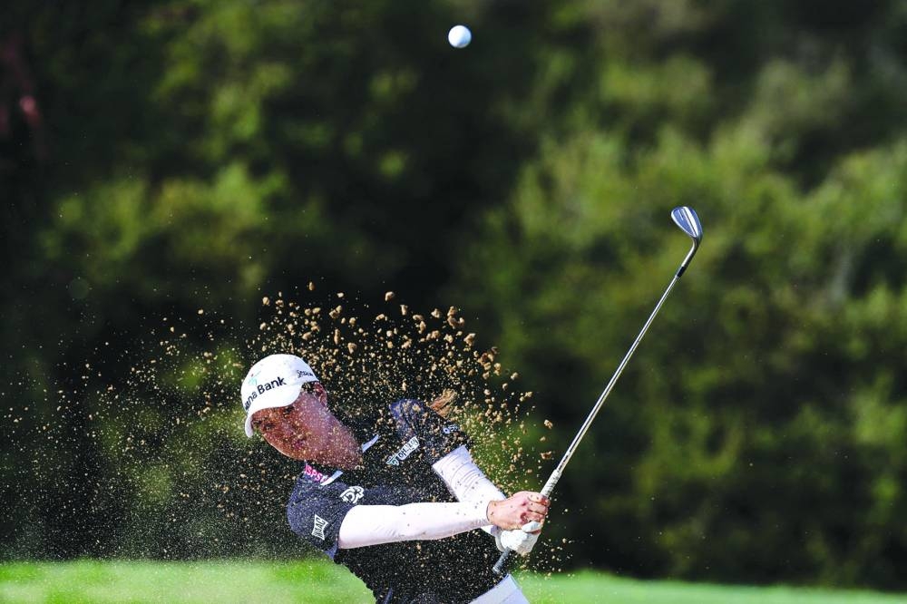 
Australia’s Minjee Lee hits a shot out of a bunker during the first round of the Australian Open at The Lakes Golf Club in Sydney yesterday. (AFP)  
