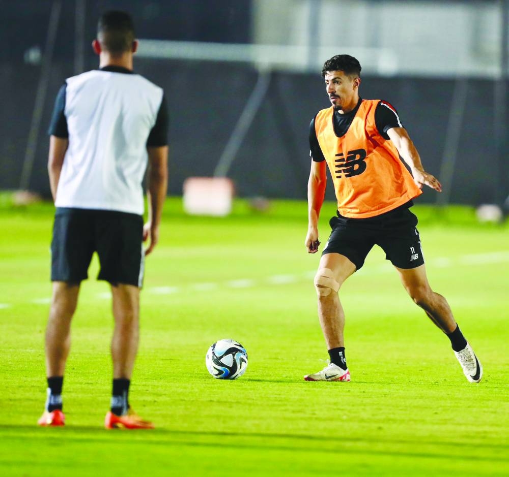 
Al Sadd striker Baghdad Bounedjah at a training session yesterday. RIGHT: Al Sadd’s head coach Wesam Rizik. 