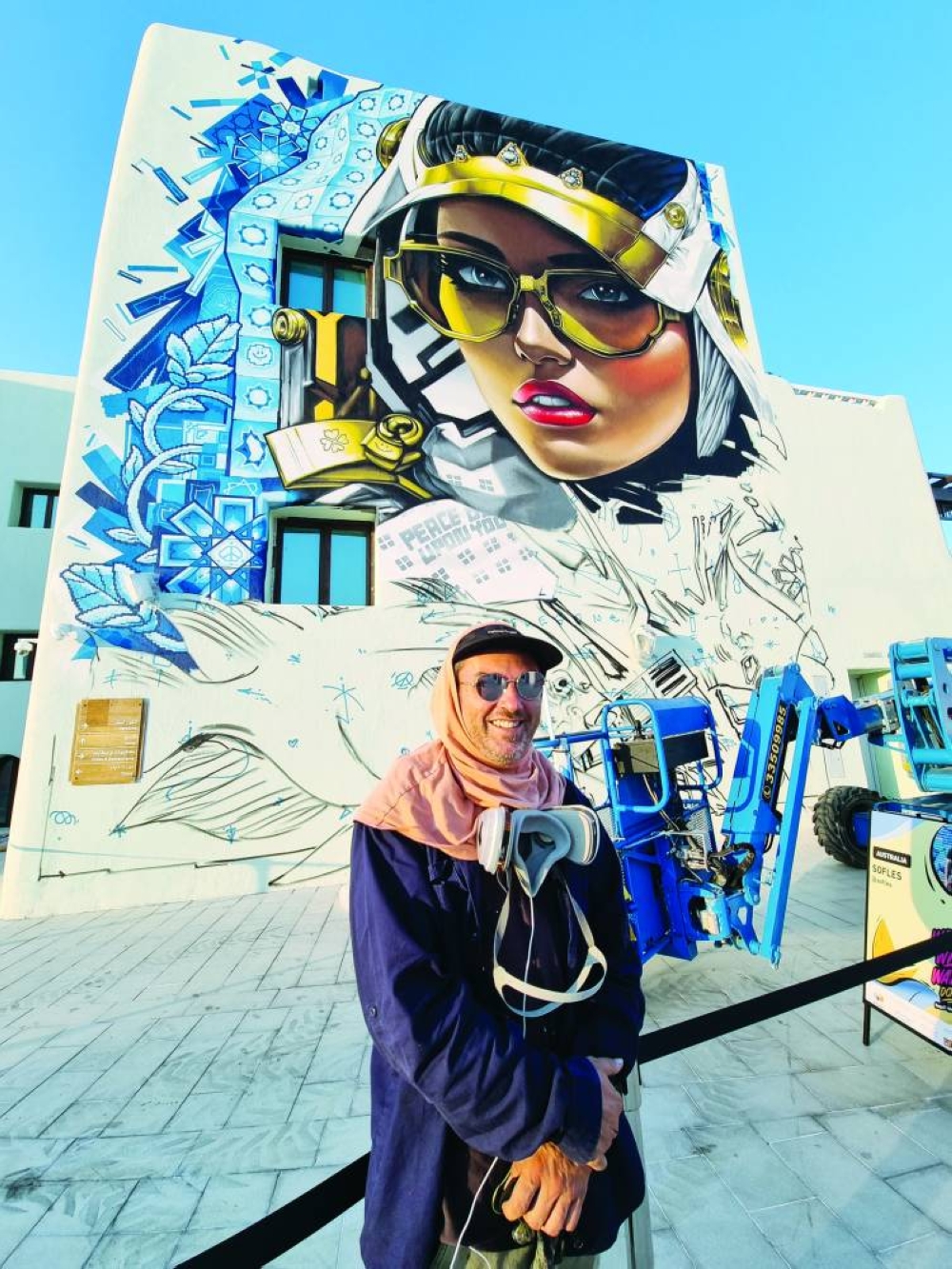Australian Sofles’s mural combines traditional patterns, a futuristic figure with a headdress, and a fish to symbolise the artwork's location at the port. PICTURE: Joey Aguilar