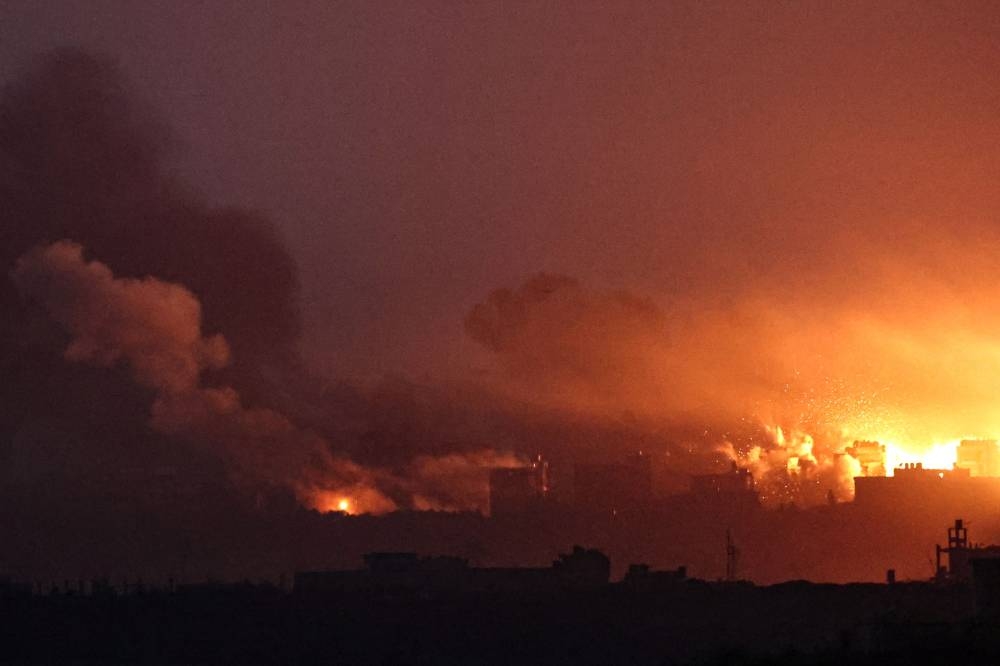 A picture taken from southern Israel near the border with the Gaza Strip on Saturday, shows an explosion and smoke billowing over the Palestinian territory during an Israeli strike as battles resumed between Israel and Hamas. AFP