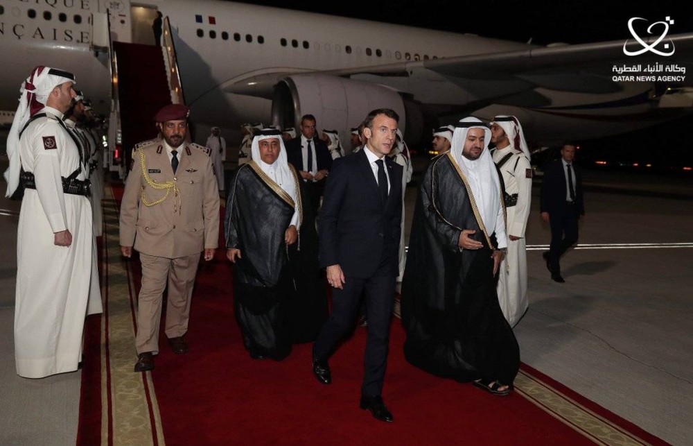HE the Minister of State for Foreign Affairs Dr. Mohammed bin Abdulaziz bin Saleh Al Khulaifi receives French President Emmanuel Macron upon his arrival at  the Hamad International Airport, Doha.