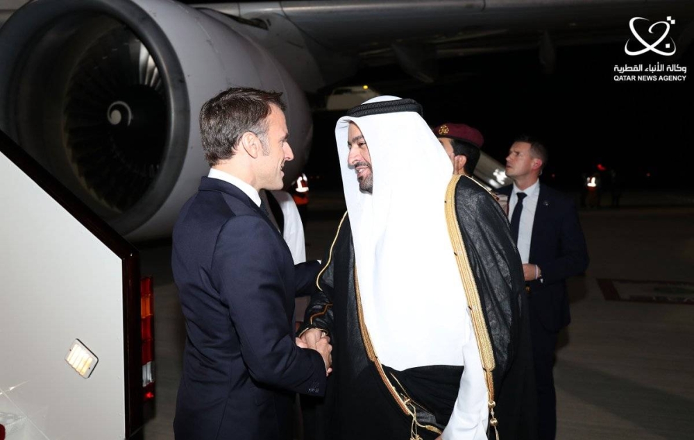 HE the Minister of State for Foreign Affairs Dr. Mohammed bin Abdulaziz bin Saleh Al Khulaifi receives French President Emmanuel Macron upon his arrival at  the Hamad International Airport, Doha.