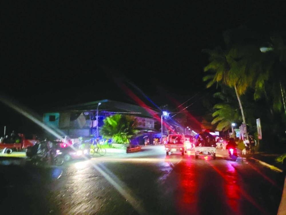 
People evacuate following an earthquake, in Hinatuan, Surigao del Sur, Philippines. 