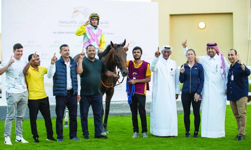 
The connections of Al Rabban Racing’s homebred Harb celebrate after the victory. 