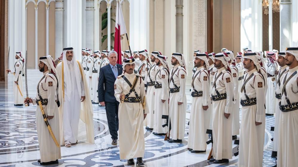 Accompanied by His Highness the Amir Sheikh Tamim bin Hamad Al-Thani, the President of the Republic of Cuba Miguel Diaz-Canel inspects a guard of honour at Lusail Palace, during the official reception ceremony.